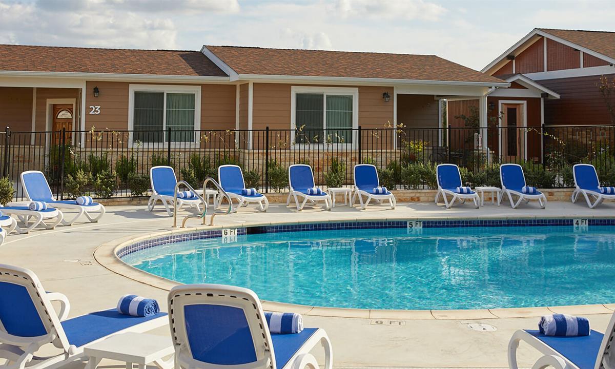 view of poolside at the resort